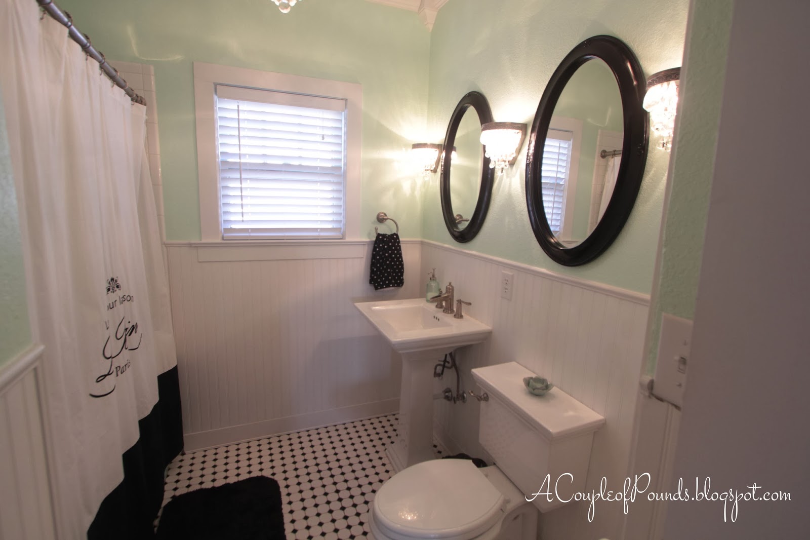 updated vintage bathroom with classic black and white tile