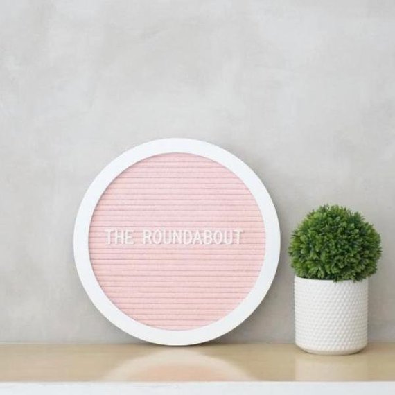 round pink blush letter board
